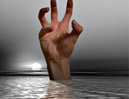 Stressed hand rising out of water