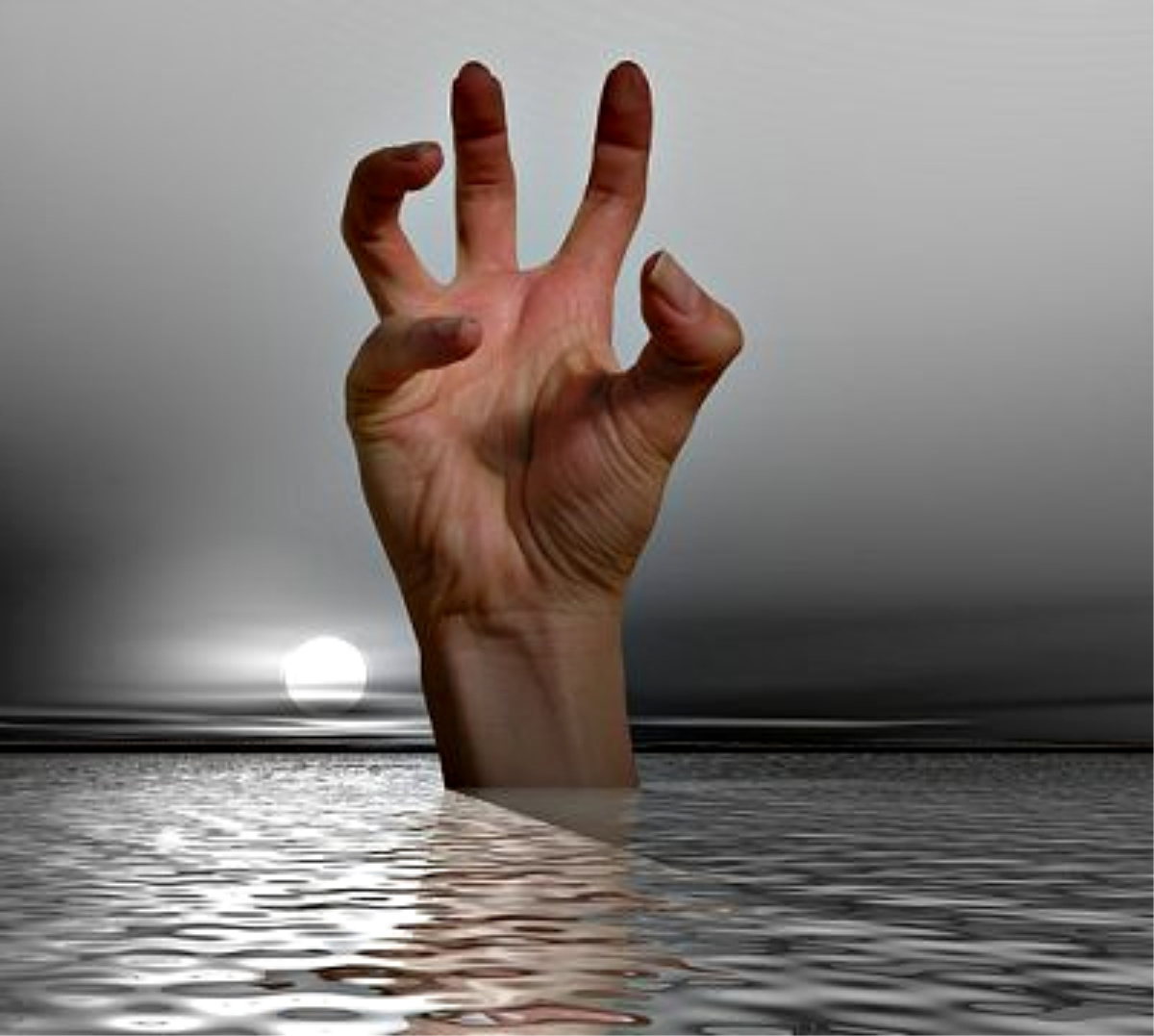 Stressed hand rising out of water