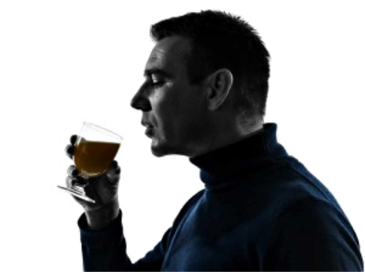 Man drinking a stress relief drink out of a glass