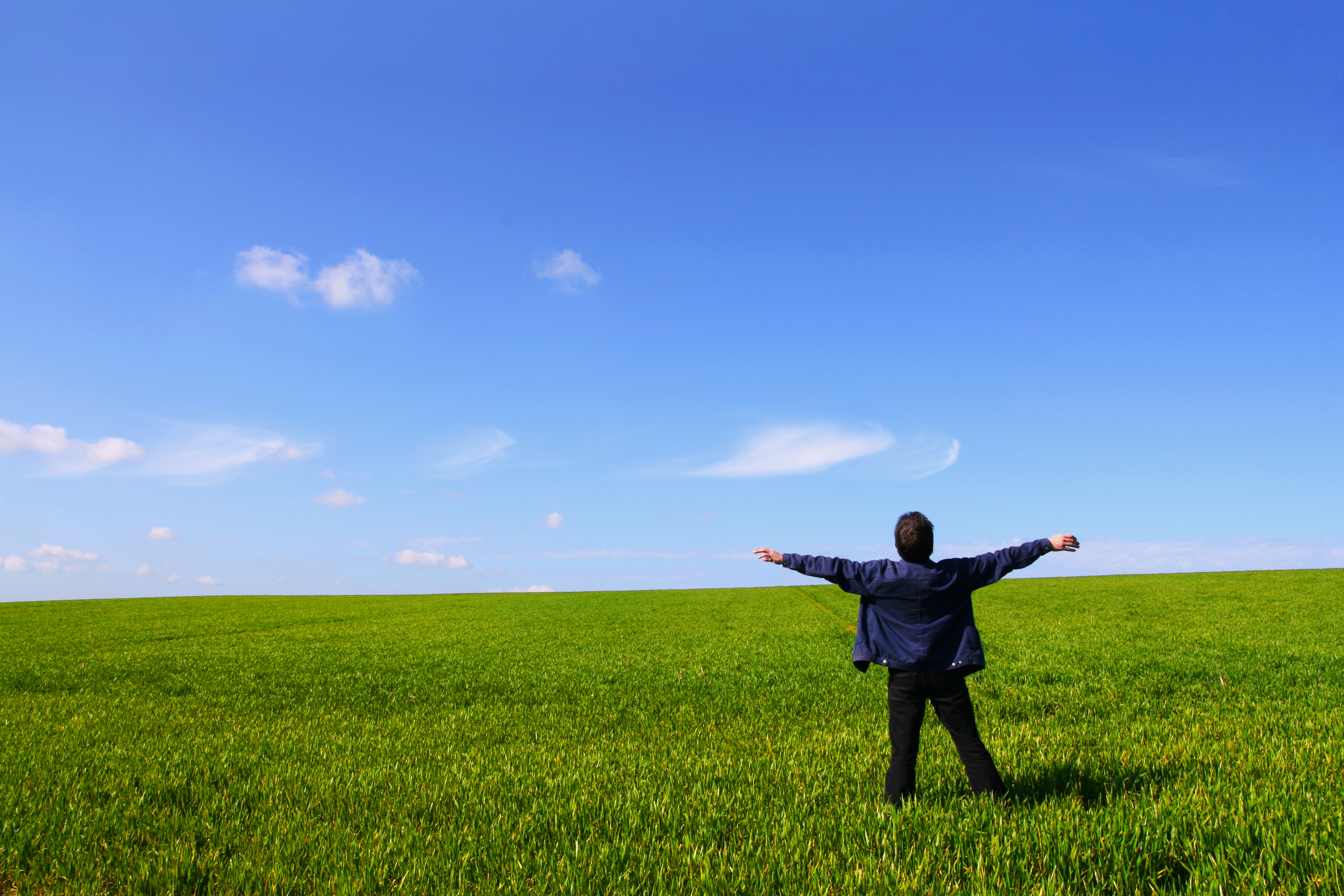 man breathing freshe air in a field