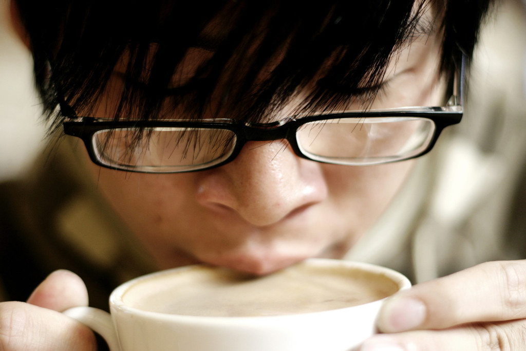 man drinking coffee because caffeine can cause stress